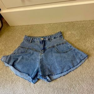 These are flair Jean shorts that sway out. Brand is Love and Labels.